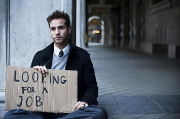 bigstock-Young-businessman-holding-sign-28364054.jpg