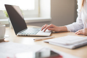 business-woman-working-on-laptop-in-her-office-picjumbo-com.jpg