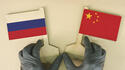 Russia-China-flags-gloves.jpg