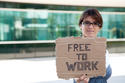 bigstock_unemployed_woman_showing_a_mes_15470339.jpg