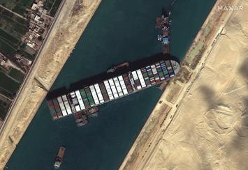 Suez_Canal_blocked_by_Ever_Given_March_27_2021.jpg Suez_Canal_blocked_by_Ever_Given_March_27_2021.jpg